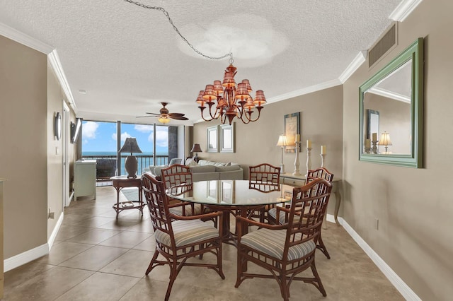 tiled dining space with crown molding, ceiling fan with notable chandelier, floor to ceiling windows, and a textured ceiling