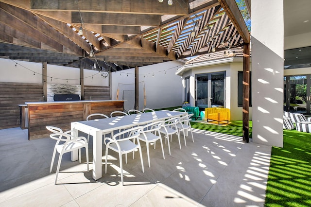 view of patio / terrace with outdoor lounge area and outdoor dry bar