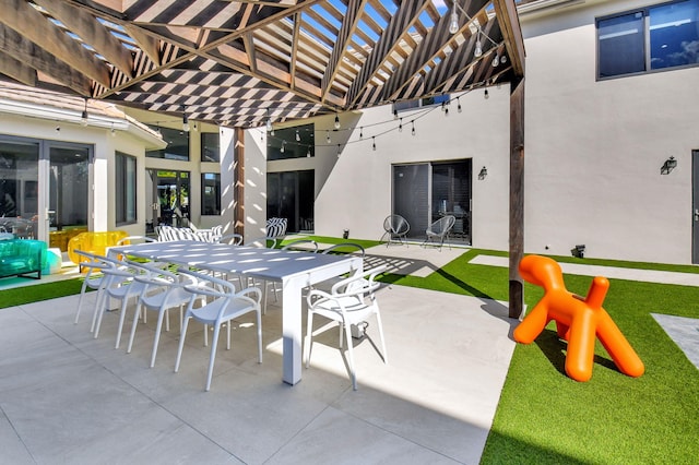 view of patio with outdoor dining area and a pergola