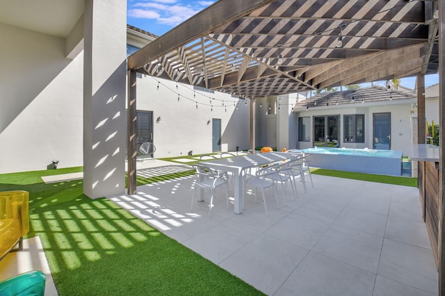 view of patio featuring outdoor dining area and a pergola