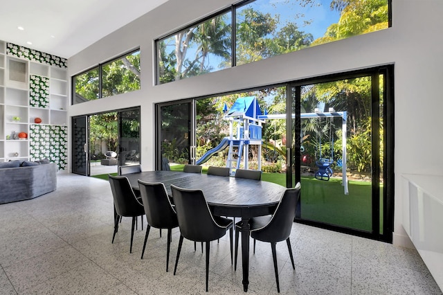 dining room featuring a high ceiling