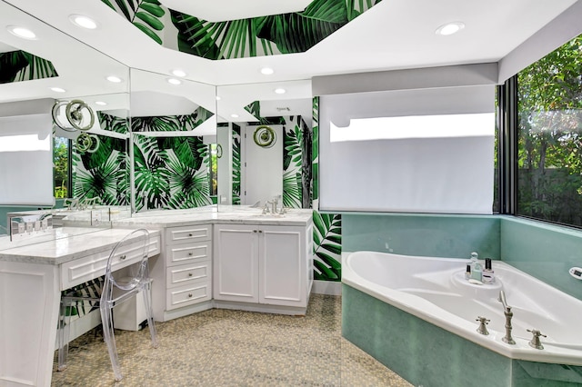 bathroom featuring granite finish floor, a garden tub, vanity, and recessed lighting