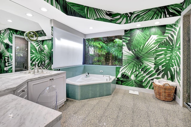 full bath with recessed lighting, a garden tub, vanity, and wallpapered walls