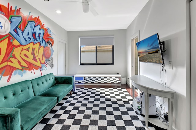 living area with a ceiling fan