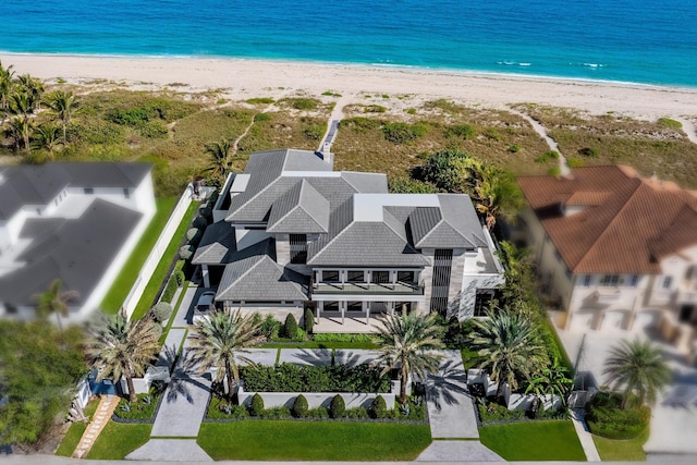 drone / aerial view with a view of the beach and a water view