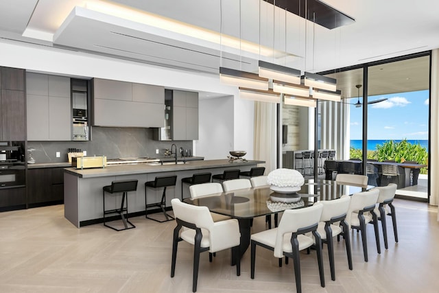 dining area featuring expansive windows and light parquet floors