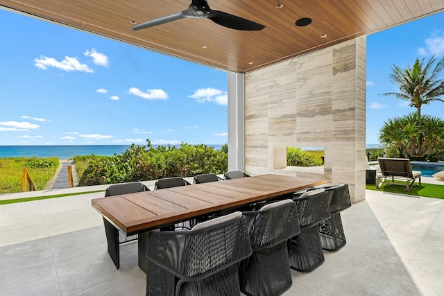 view of patio / terrace with a water view and ceiling fan