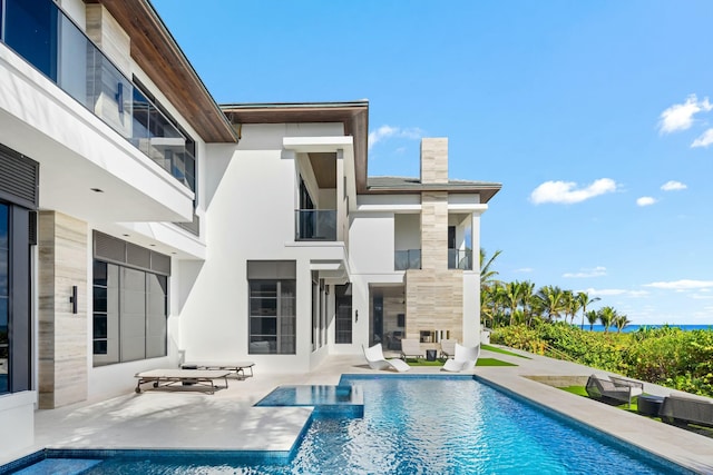 view of pool featuring a patio