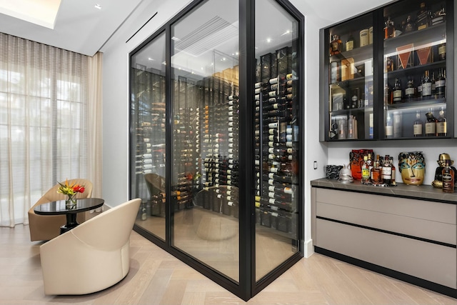 wine room with light parquet floors