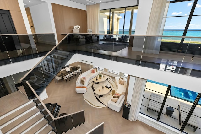 interior space featuring a water view and parquet floors