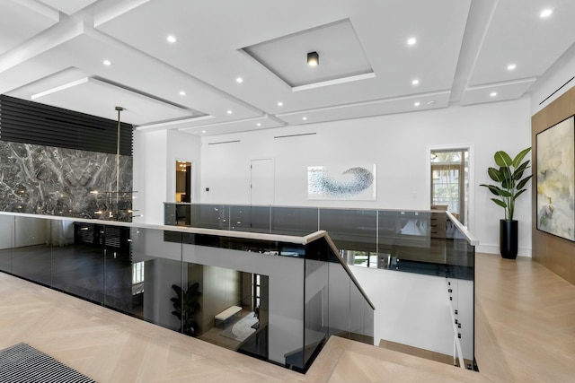 interior space with pendant lighting, backsplash, and light parquet floors