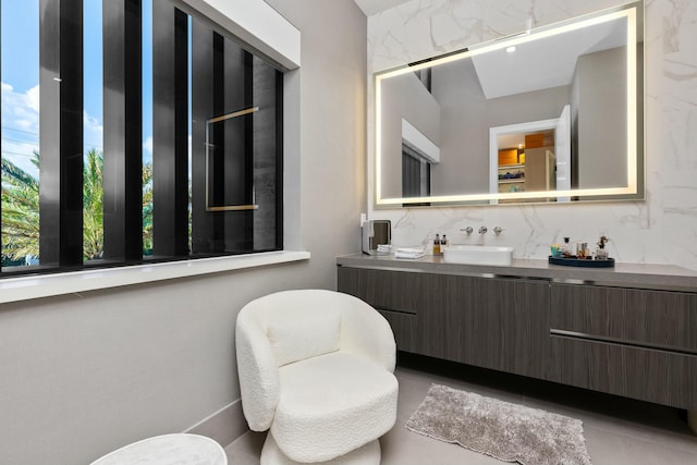 bathroom featuring tasteful backsplash and vanity