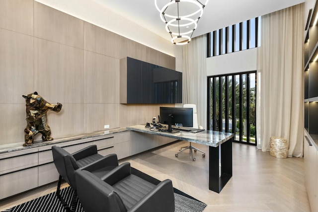 office space featuring an inviting chandelier and light parquet floors