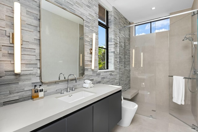 bathroom featuring vanity, tile walls, an enclosed shower, and toilet