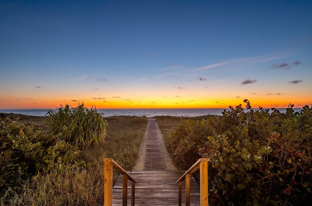 surrounding community with a water view