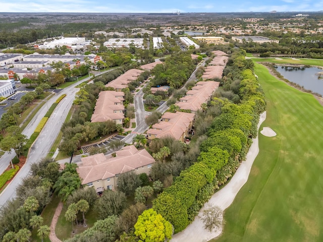 birds eye view of property with a residential view, view of golf course, and a water view