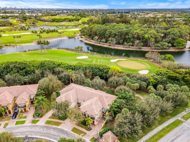 aerial view featuring view of golf course and a water view