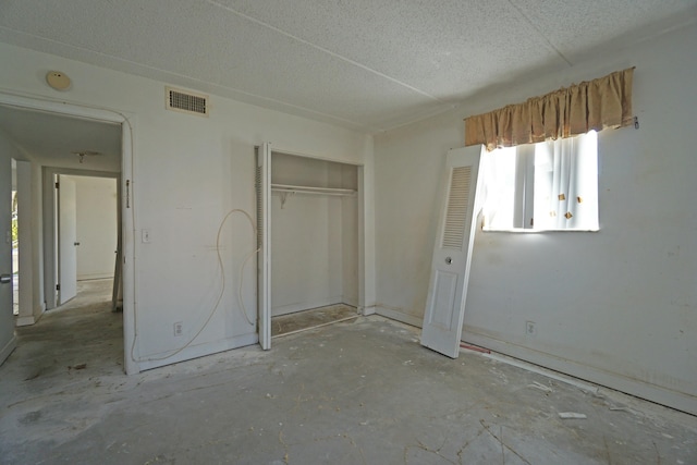 unfurnished bedroom with a closet