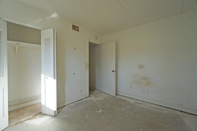 unfurnished bedroom with a closet