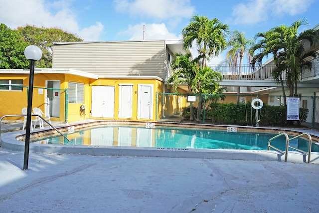 view of swimming pool with a patio area