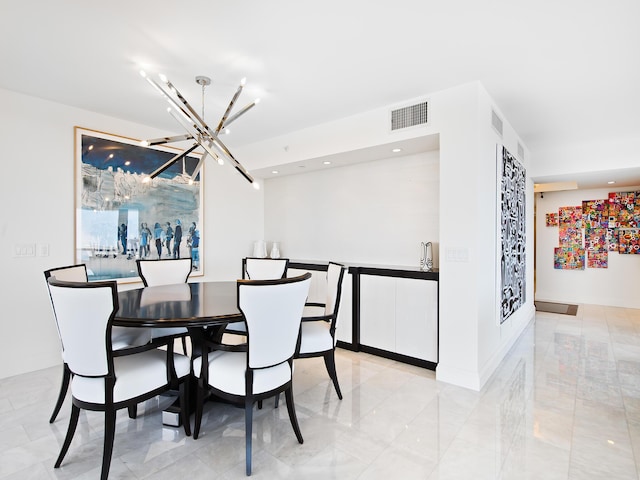 dining space with a notable chandelier