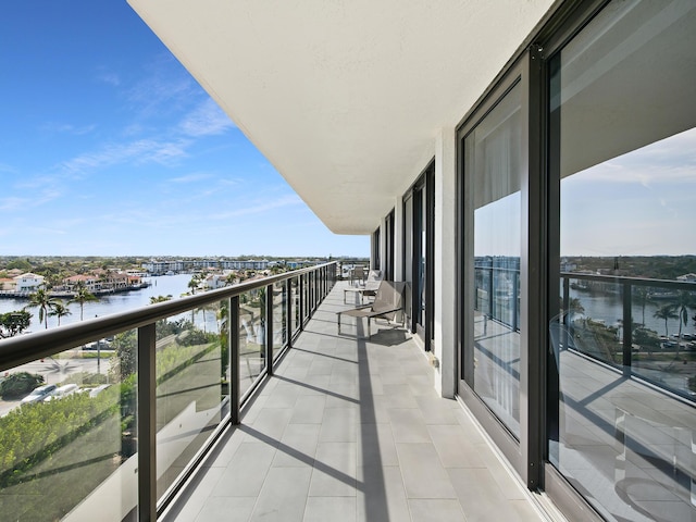 balcony featuring a water view