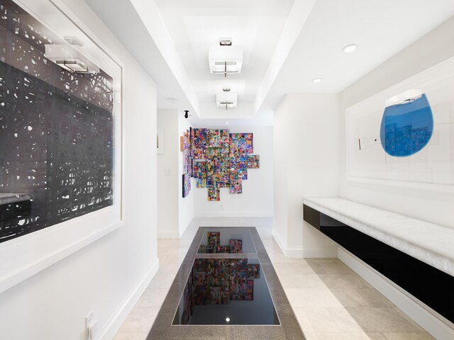 hallway with light tile patterned flooring