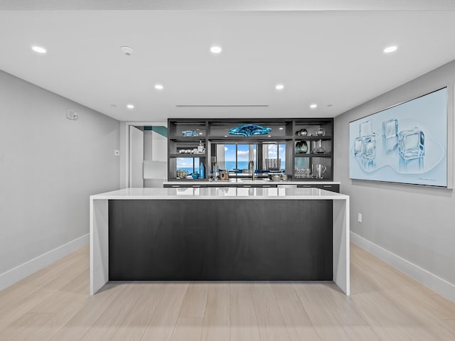 kitchen featuring light wood-type flooring and a center island