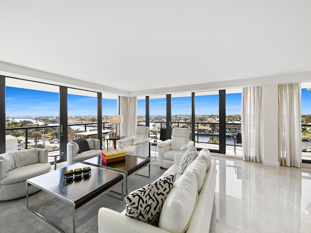 living room featuring a water view and expansive windows