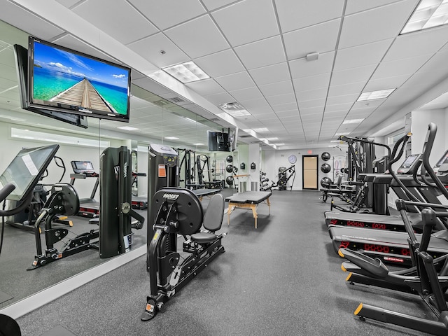 exercise room featuring a paneled ceiling