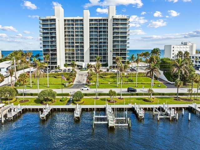 birds eye view of property with a water view