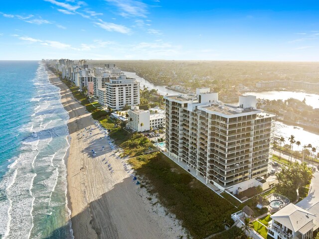 aerial view featuring a water view and a beach view