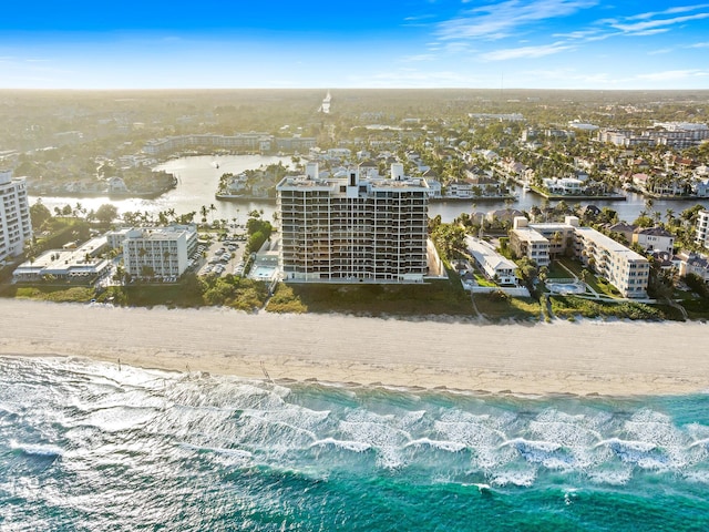 bird's eye view with a water view and a view of the beach