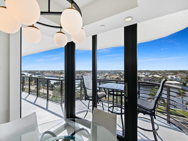 balcony featuring a water view