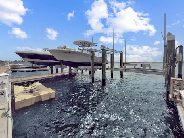 view of dock featuring a water view and boat lift