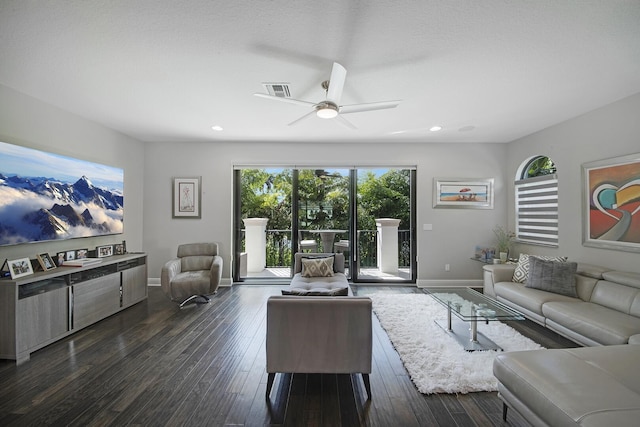 living room with recessed lighting, visible vents, dark wood finished floors, and baseboards