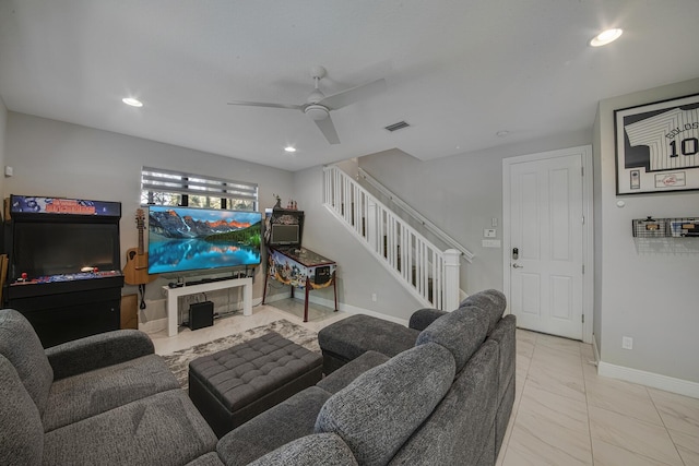 living room featuring baseboards, visible vents, a ceiling fan, stairway, and recessed lighting