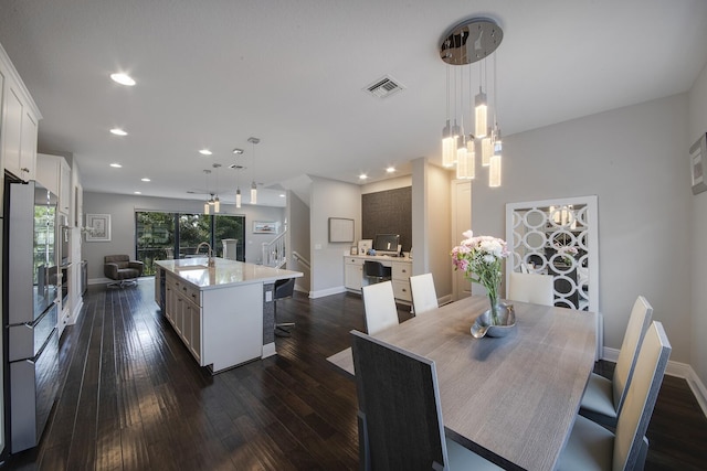 dining room with recessed lighting, dark wood-type flooring, visible vents, baseboards, and stairs