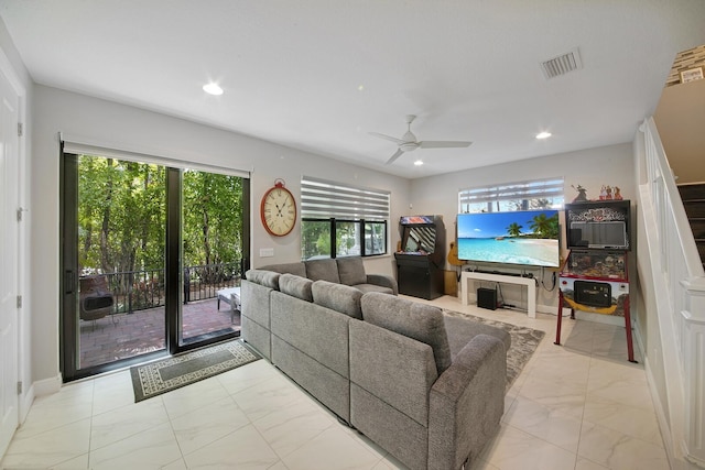 living room featuring marble finish floor, a ceiling fan, visible vents, and recessed lighting