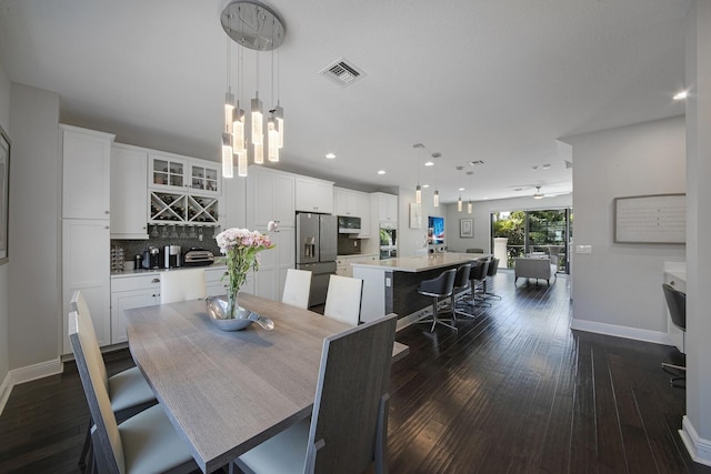 dining area featuring ceiling fan, recessed lighting, visible vents, baseboards, and dark wood finished floors