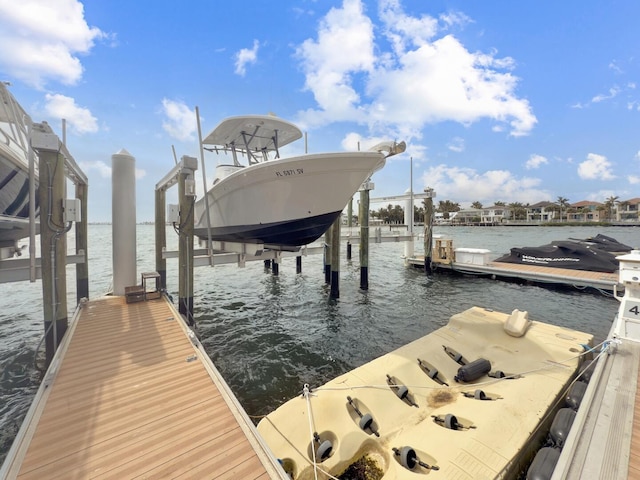 view of dock with a water view and boat lift