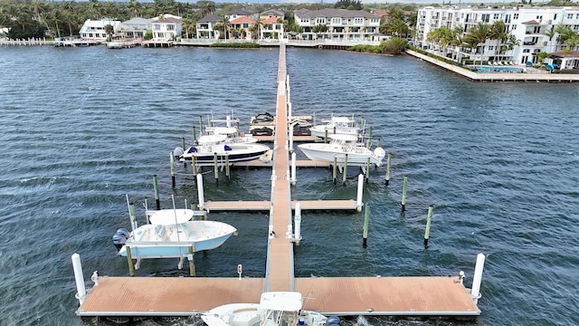 dock area with a water view and boat lift