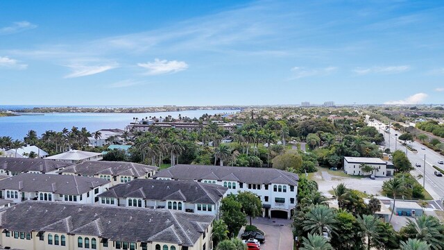 drone / aerial view with a water view and a residential view