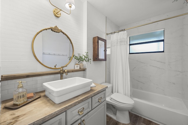 full bathroom featuring toilet, vanity, shower / bathtub combination with curtain, hardwood / wood-style floors, and decorative backsplash