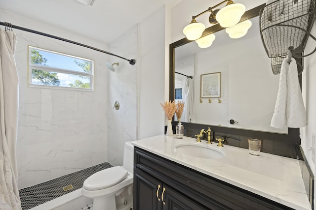 bathroom featuring vanity, toilet, and curtained shower