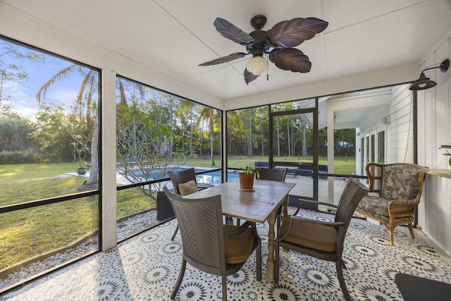 sunroom with ceiling fan and plenty of natural light