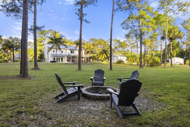 view of yard featuring an outdoor fire pit