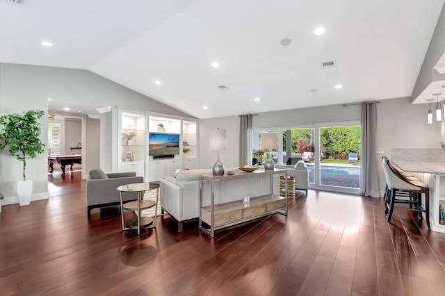 living room featuring vaulted ceiling and dark wood-type flooring