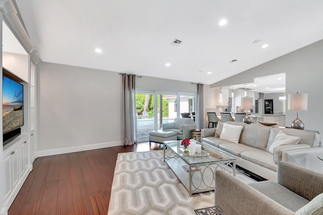 living room with vaulted ceiling and light hardwood / wood-style floors