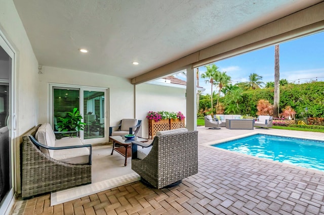 view of swimming pool with an outdoor hangout area and a patio area